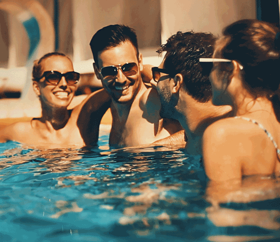 Smiling friends  in outdoor swimming pool