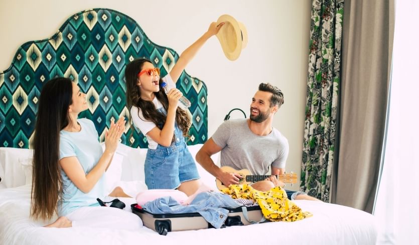 Friends enjoying their staycation in a luxury hotel room
