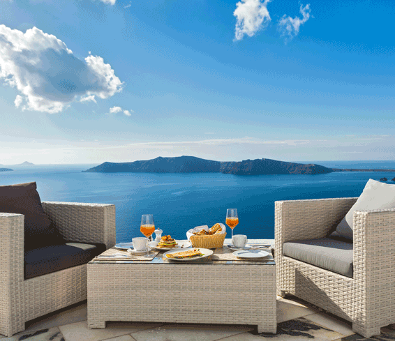 Breakfast for two on a balcony over Greek coast